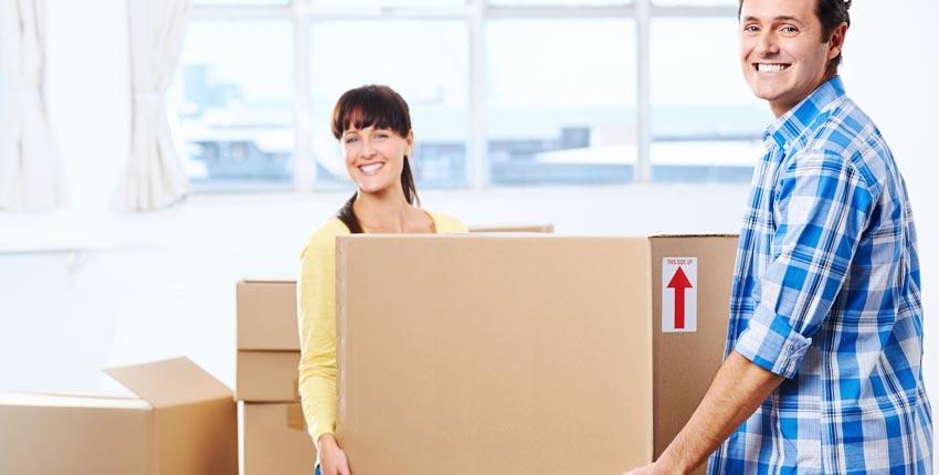 Young couple moving their house belongings