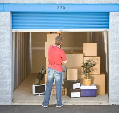 Two men moving fridge